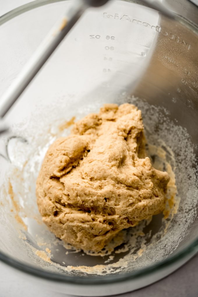 S'mores cinnamon roll dough ingredients coming together in the bowl of a stand mixer.