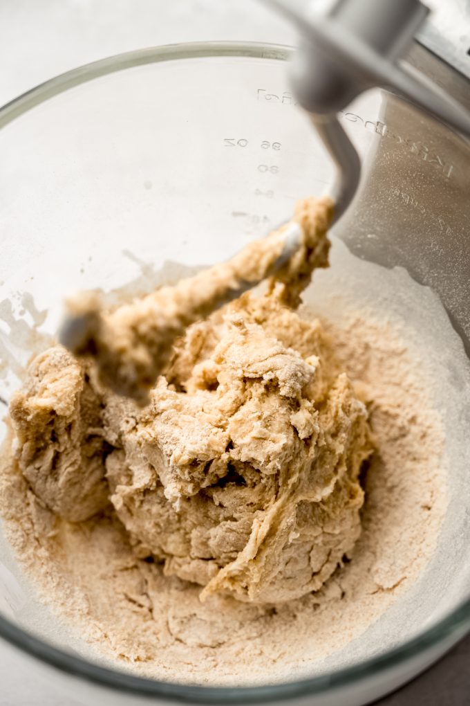 S'mores cinnamon roll dough ingredients coming together in the bowl of a stand mixer.