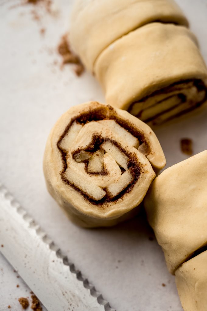 Apple cinnamon rolls sliced before baking.