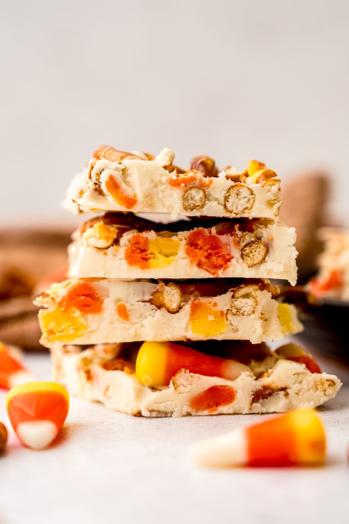 A stack of candy corn bark on a surface.