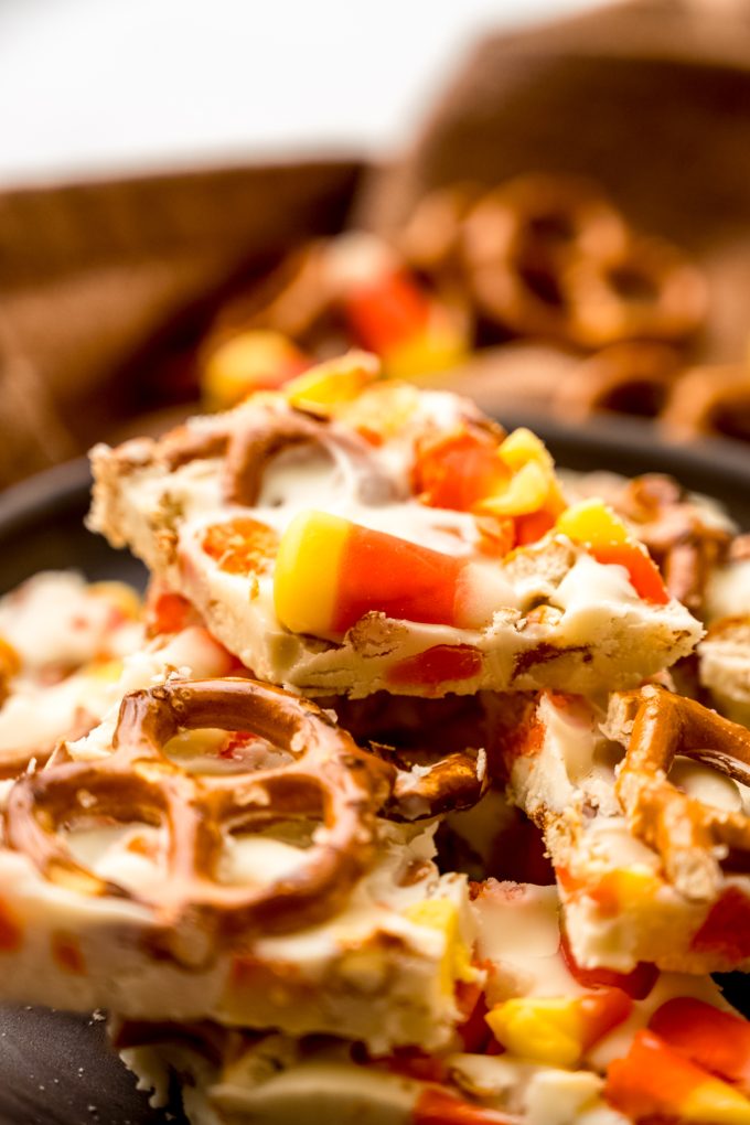 Candy corn pretzel bark on a plate.
