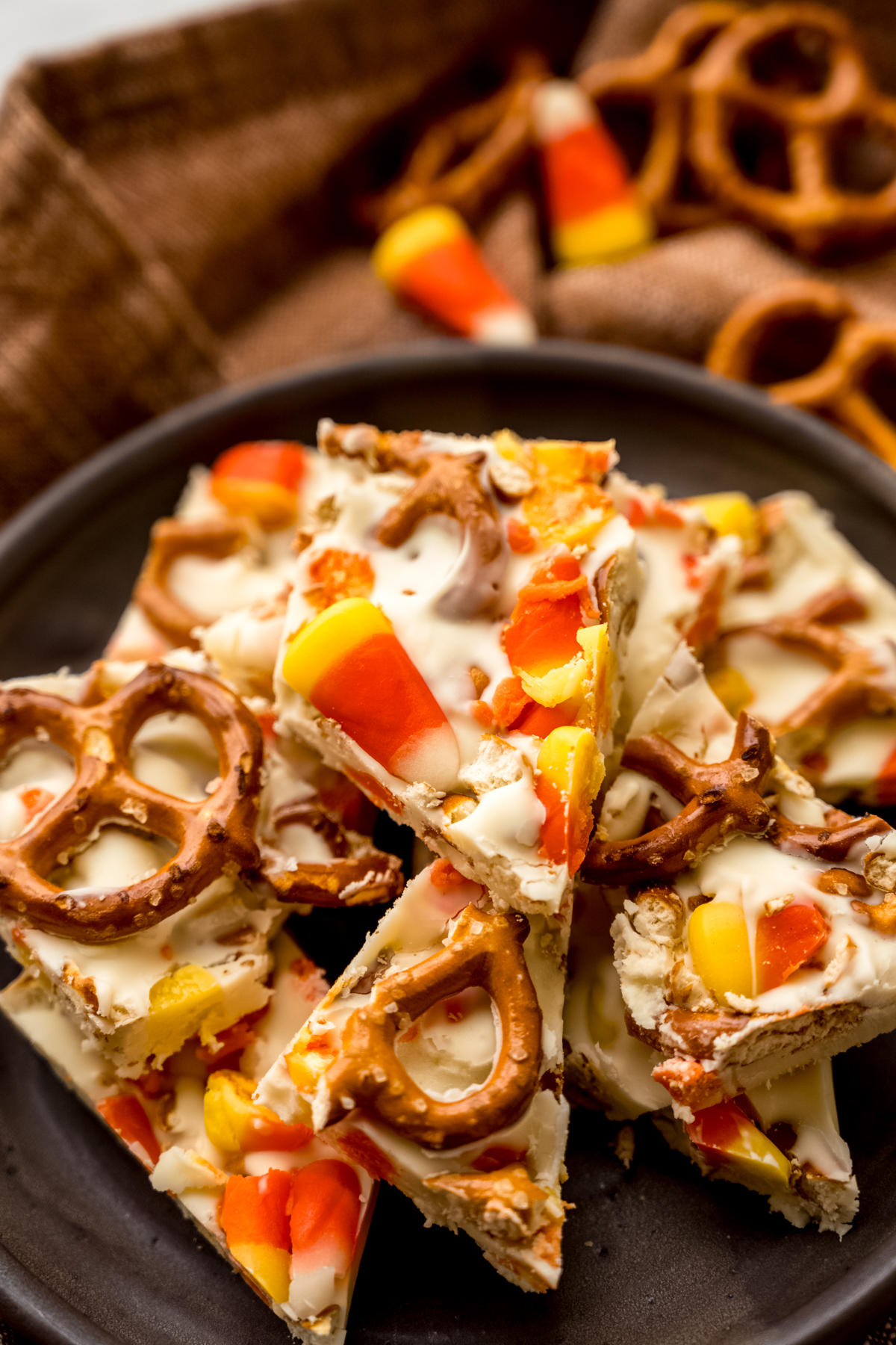 A plate of pieces of candy corn bark.