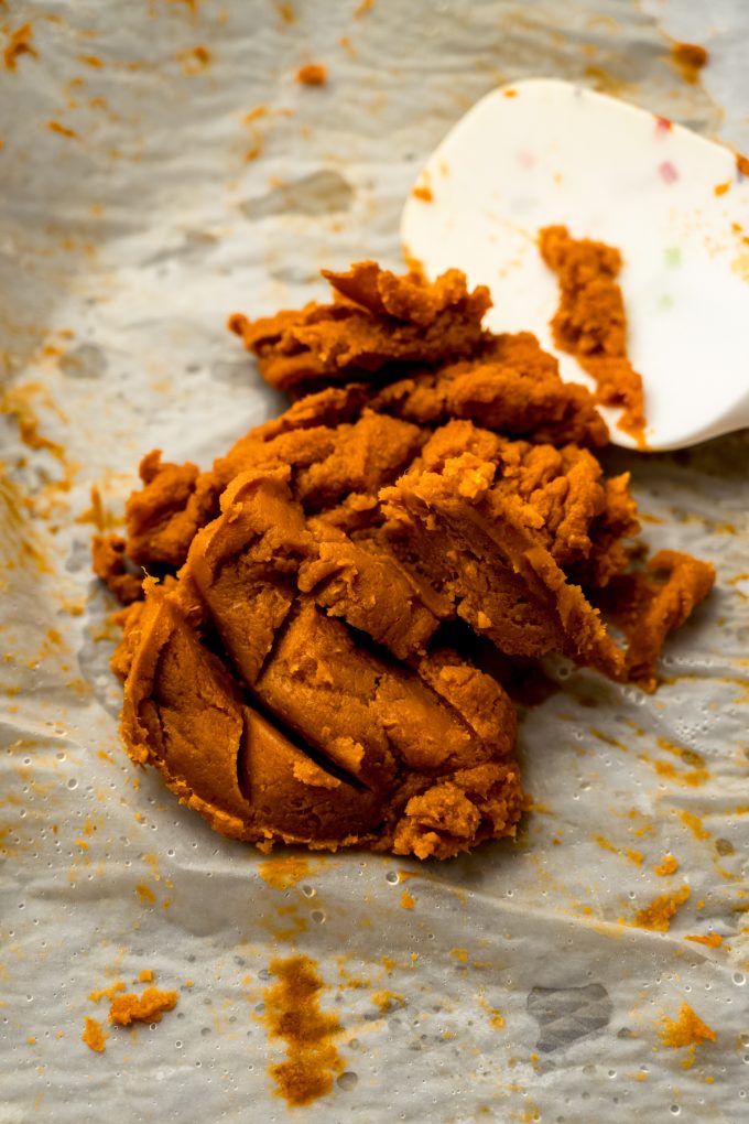 Roasted pumpkin puree on a baking sheet.