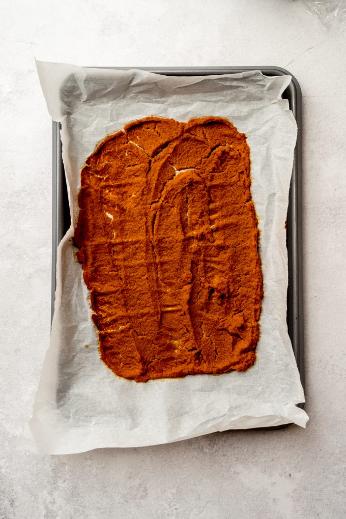 Roasted pumpkin puree on a baking sheet.