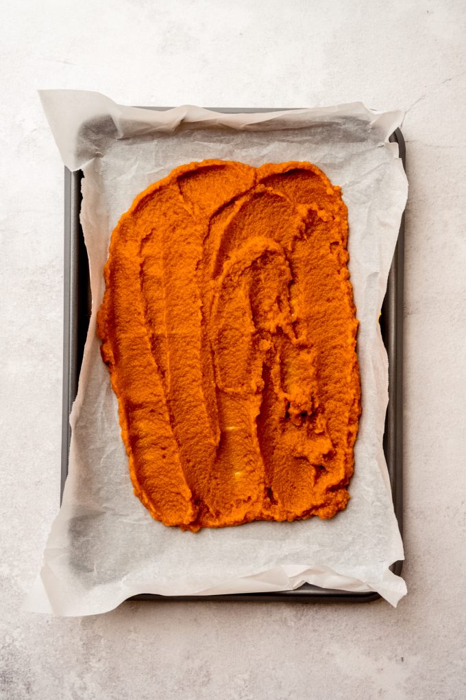 Pumpkin puree on a baking sheet.