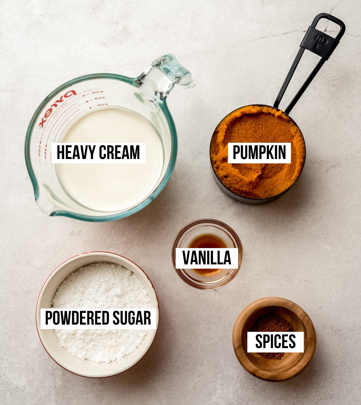 Aerial photo of ingredients to make pumpkin mousse with text overlay labeling each ingredient.