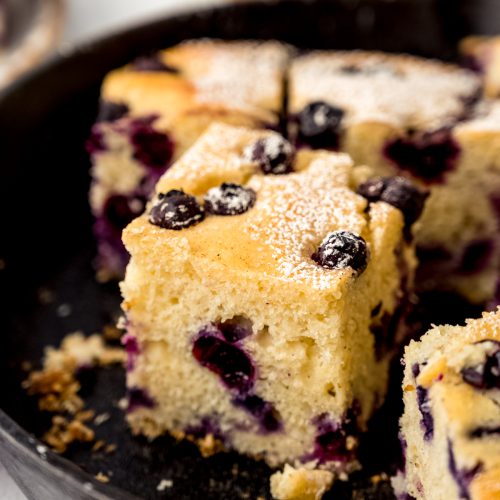 Blueberry cornbread in a cast iron skillet.