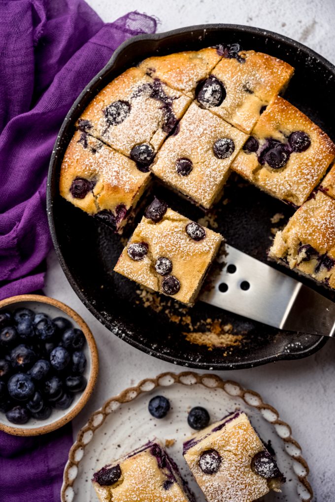 Aerial photo of blueberry cornbread in a skillet.