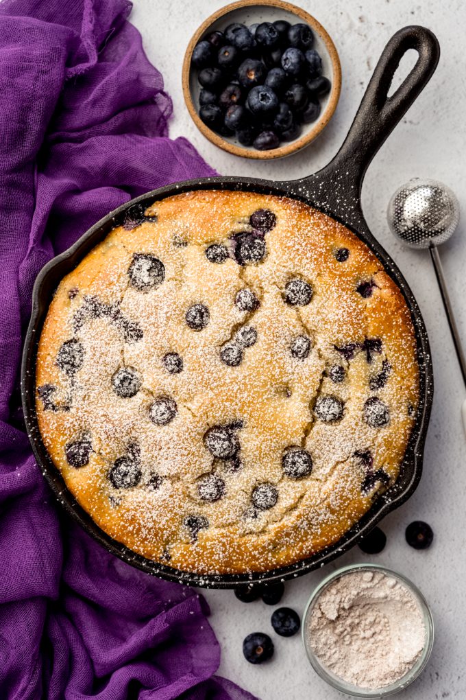 Aerial photo of blueberry cornbread in a skillet.