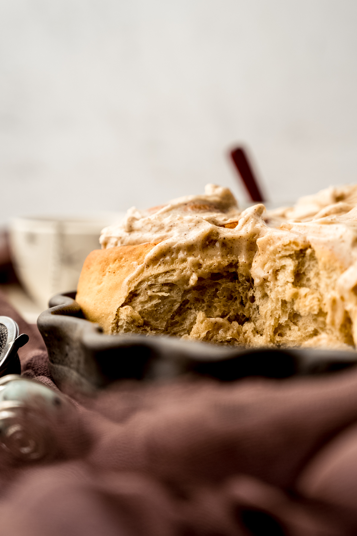 A baking dish with chai cinnamon rolls in it.