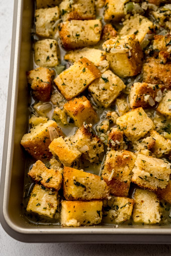 A closeup of cornbread stuffing before baking.