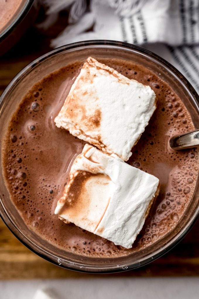 Aerial photo of a mug of hot chocolate with homemade marshmallows in it.