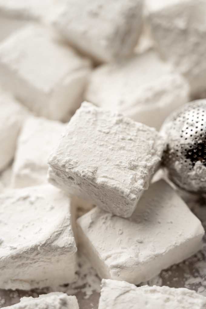 Homemade marshmallows on a surface.