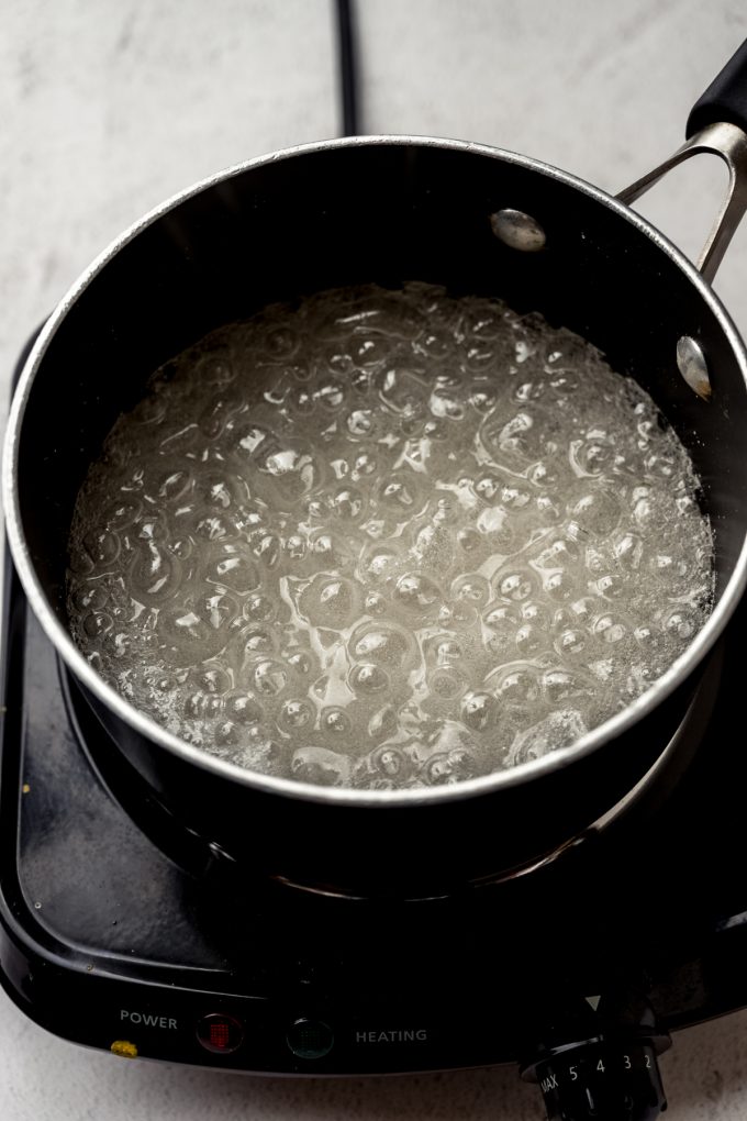 A saucepan of boiling sugar syrup.