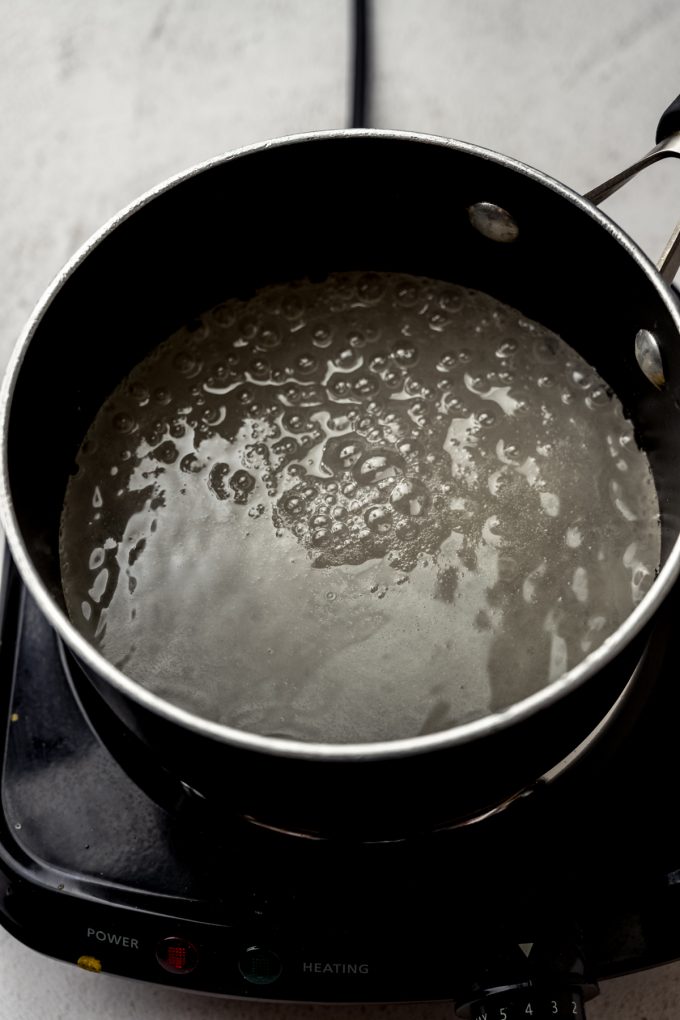 A saucepan of boiling sugar syrup.