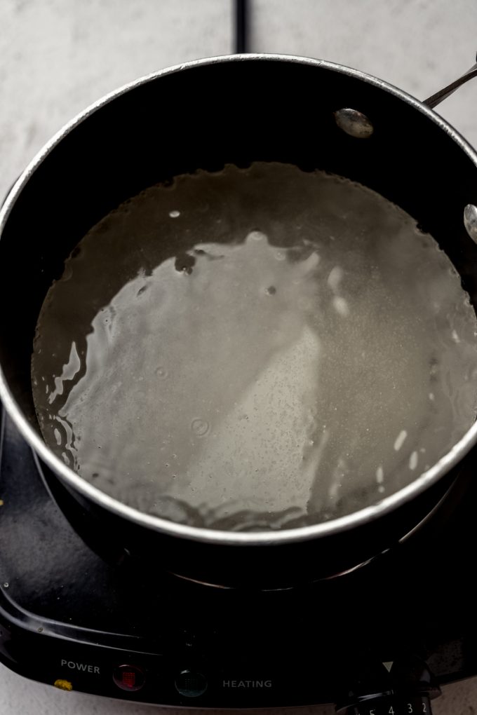 A saucepan of boiling sugar syrup.