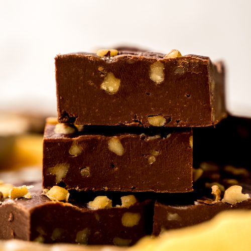A stack of microwave fudge on a yellow kitchen towel.