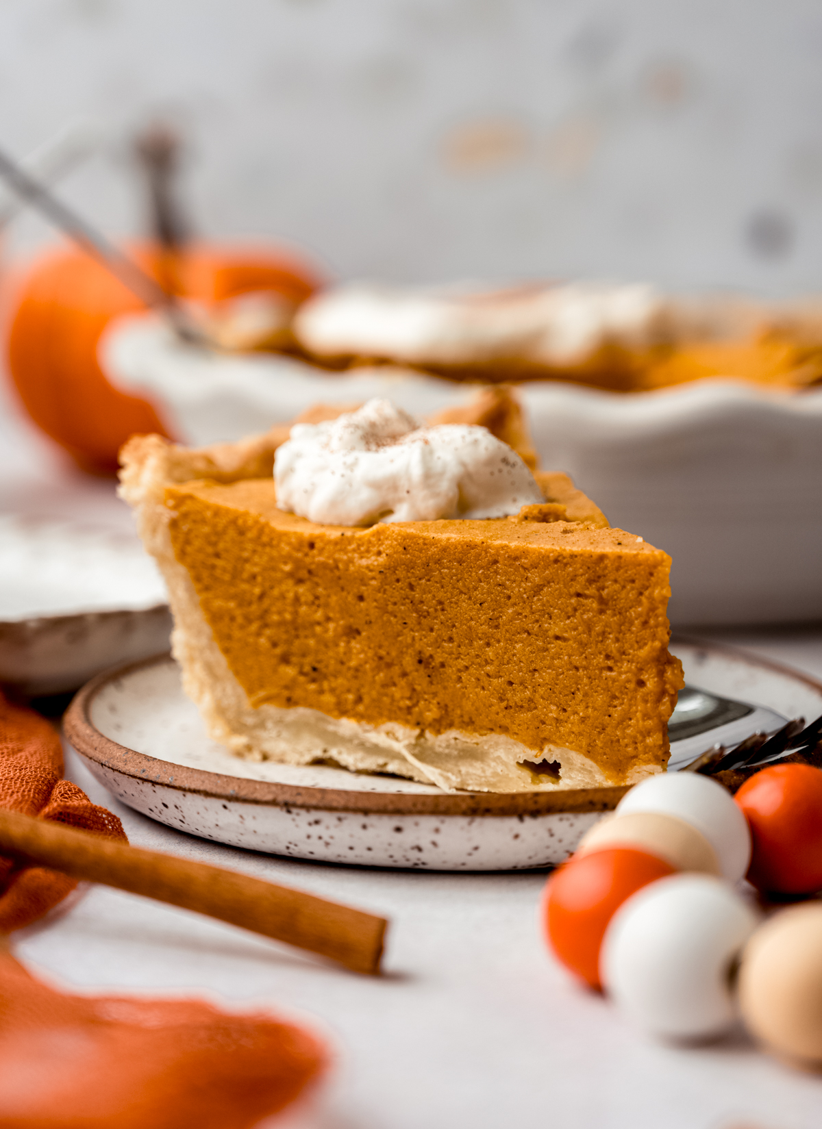 A slice of pumpkin chiffon pie on a plate.