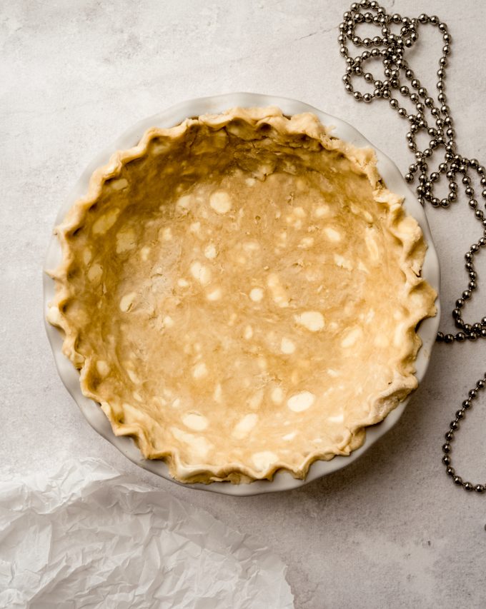 Aerial photo of pie dough pressed into a pie plate.