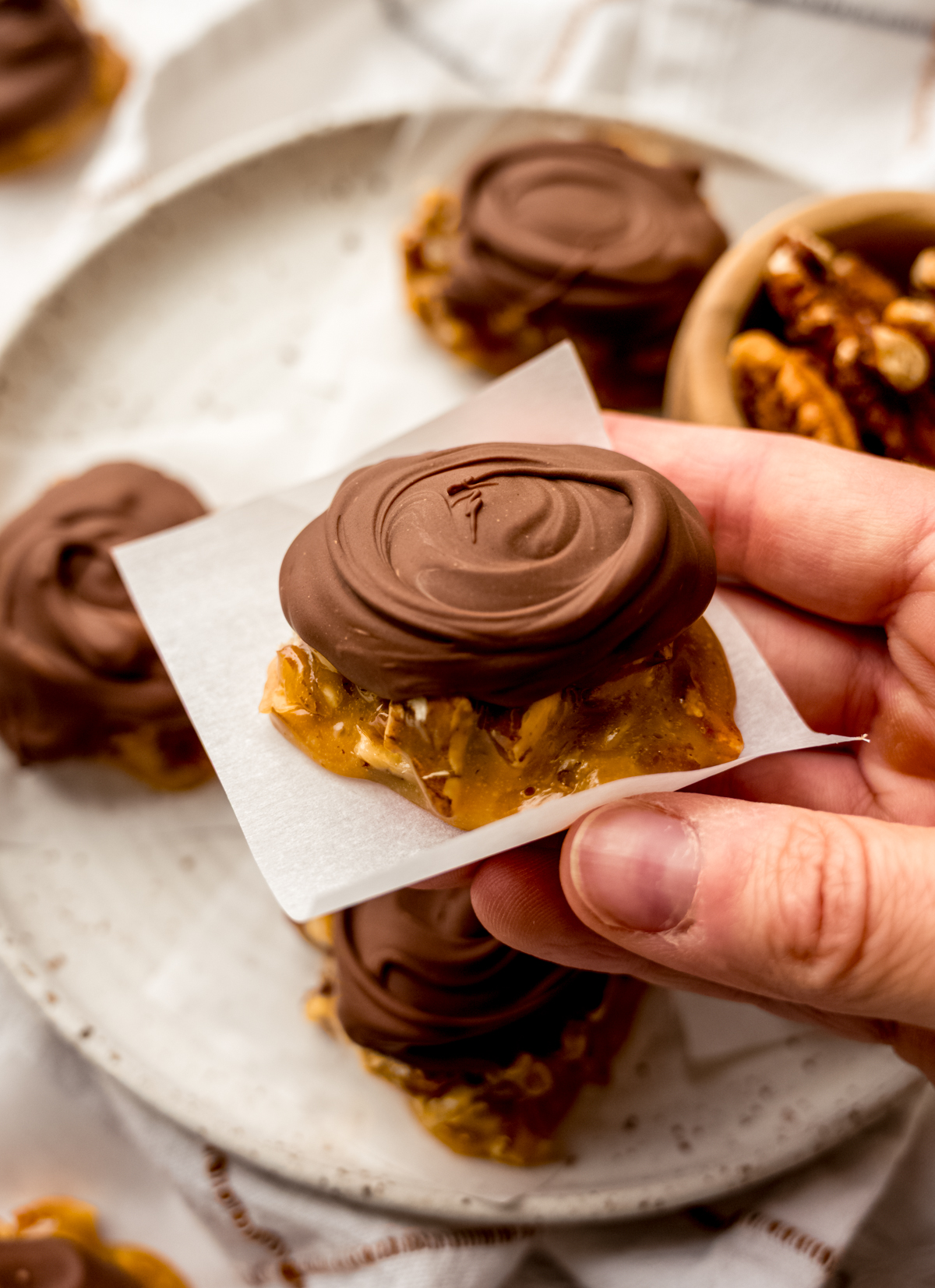Someone is holding a homemade turtle candy.