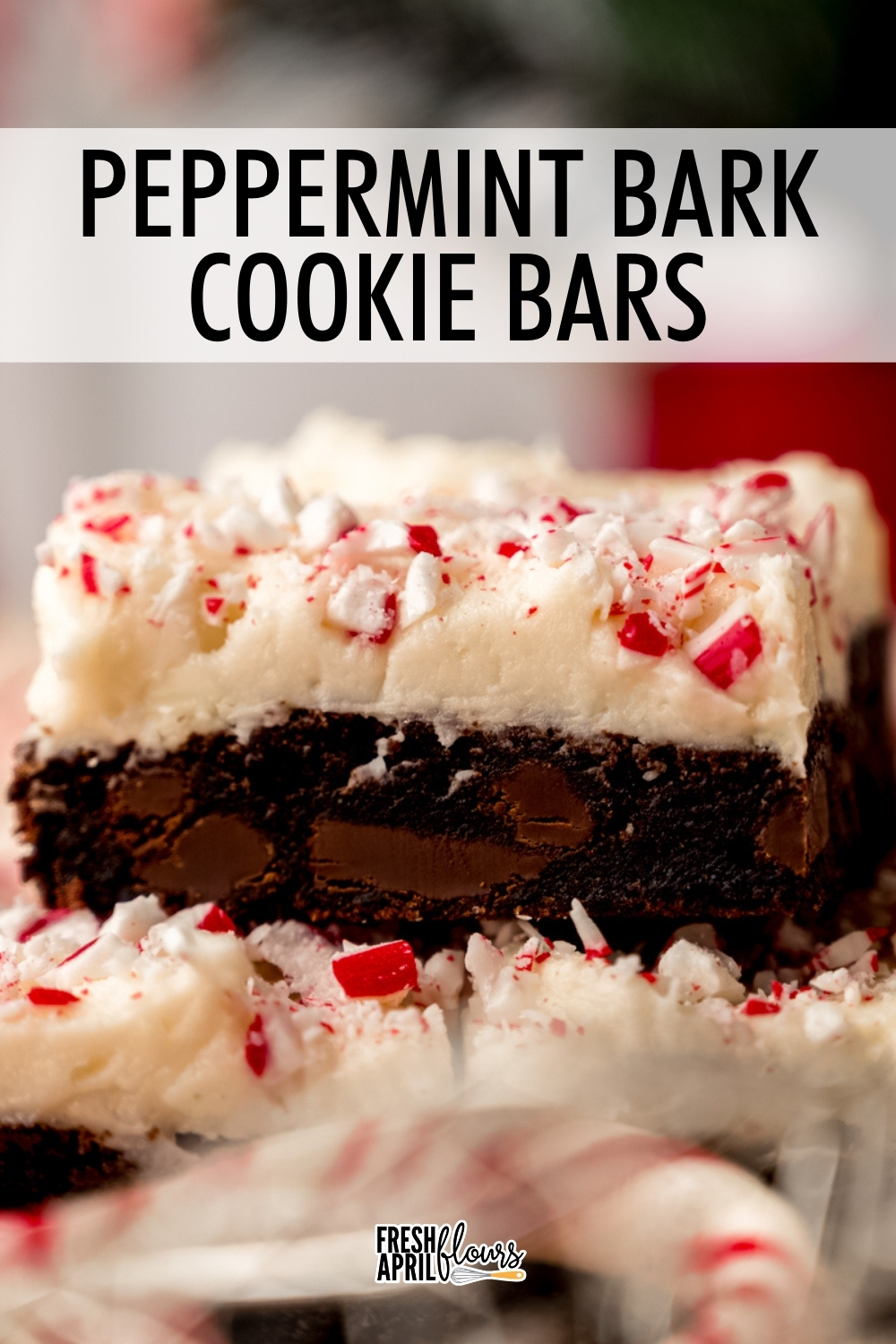 Sink your teeth into a soft and chewy chocolate chunk cookie bar topped with chunky white chocolate peppermint frosting. It's everything you love about peppermint bark in a gourmet cookie bar. via @frshaprilflours