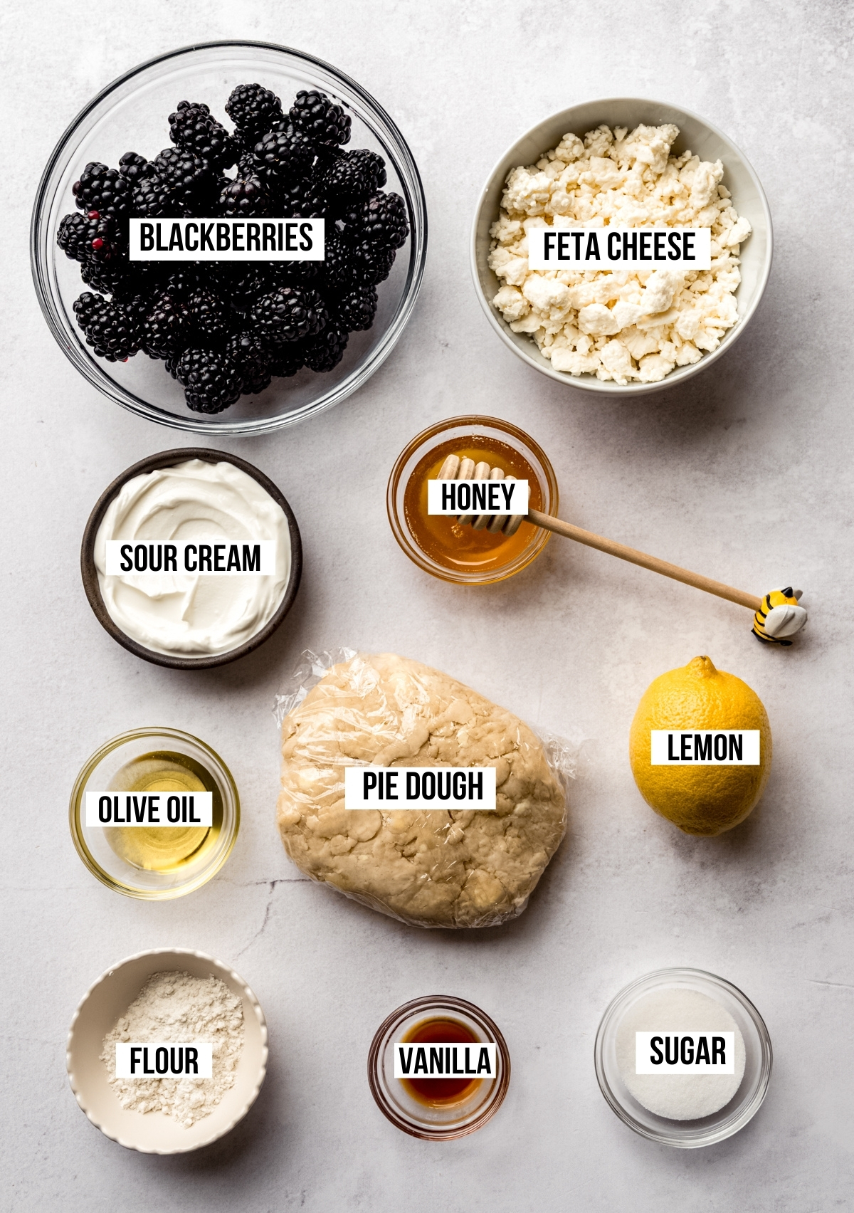 Aerial photo of ingredients to make blackberry galette with text overlay labeling each ingredient.