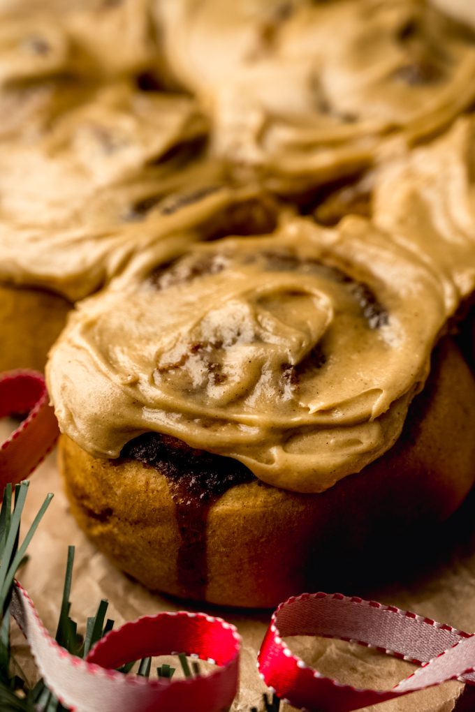 Gingerbread cinnamon rolls on parchment paper.