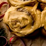 Aerial photo of gingerbread cinnamon rolls on parchment paper.