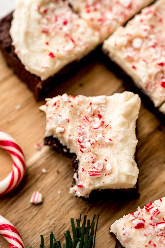 A peppermint bark cookie bar with a bite taken out of it.