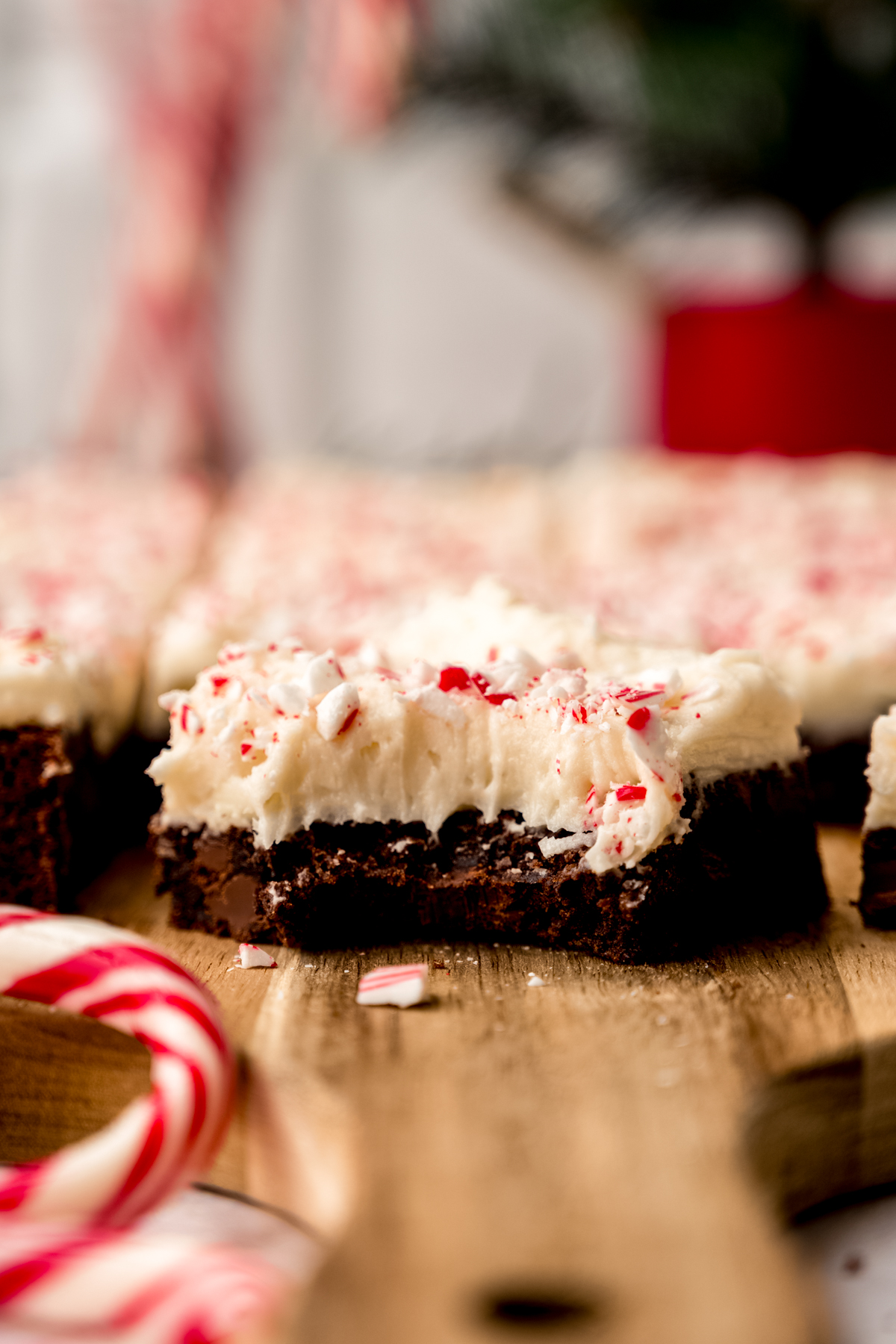 A peppermint bark cookie bar with a bite taken out of it.