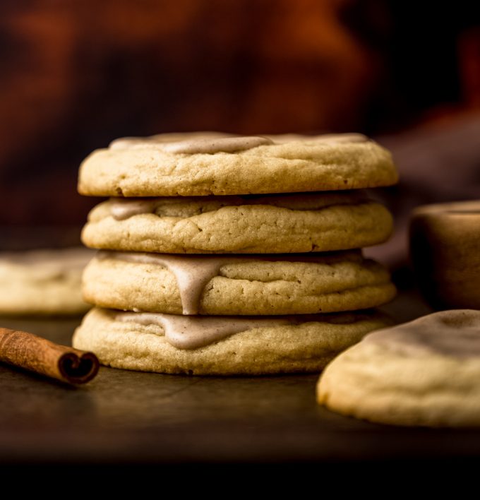 A stack of frosted brown sugar Pop Tart cookies on a baking sheet.