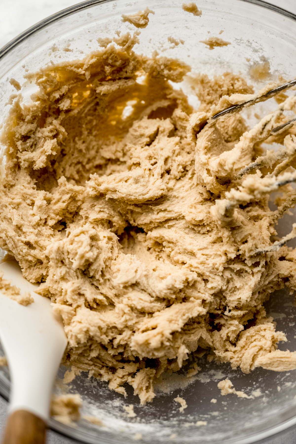 Brown sugar Pop Tart cookie dough in a bowl with a spatula in it.