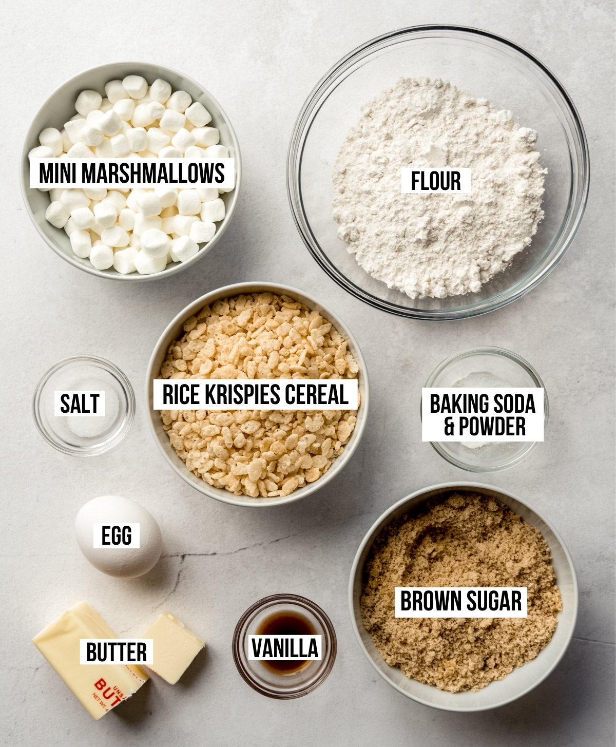 Aerial photo of ingredients to make Rice Krispie cereal with text overlay labeling each ingredient.