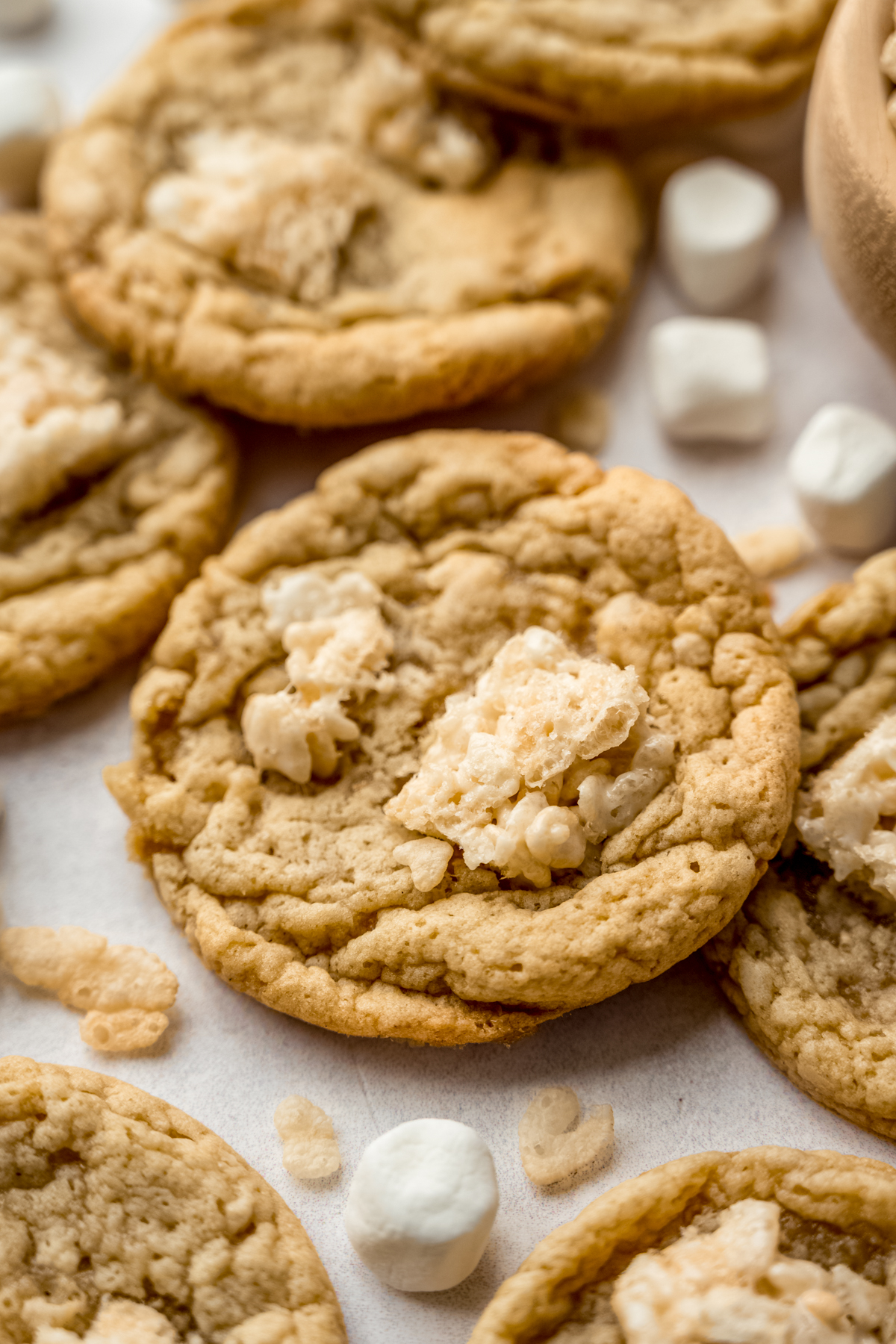 Rice Krispie treat cookies on a cooling surface.