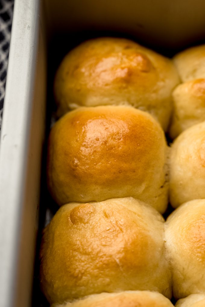 Mini slider rolls in a baking pan.