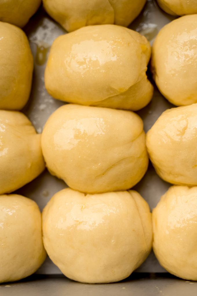 Mini slider rolls in a baking pan.