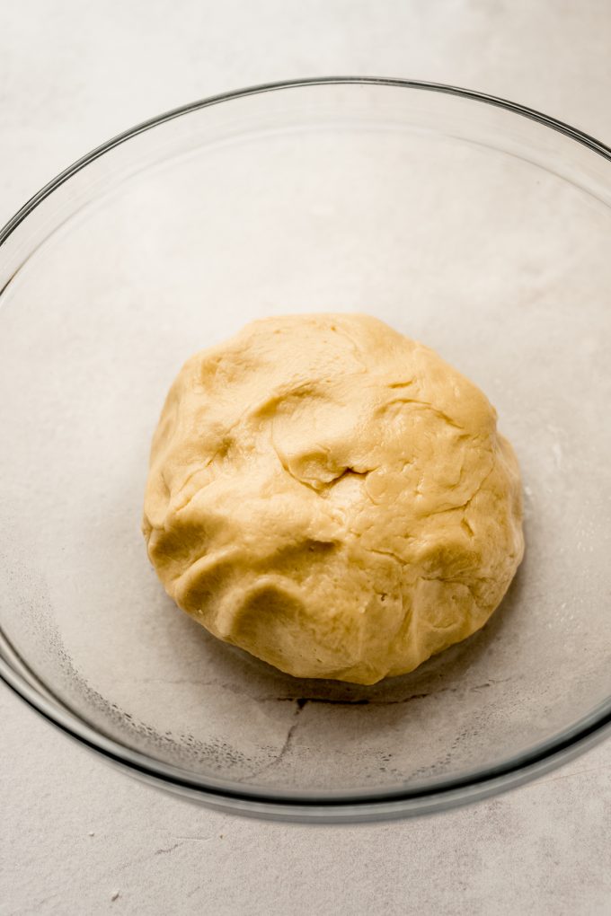 Mini slider roll dough in a bowl before it has risen.