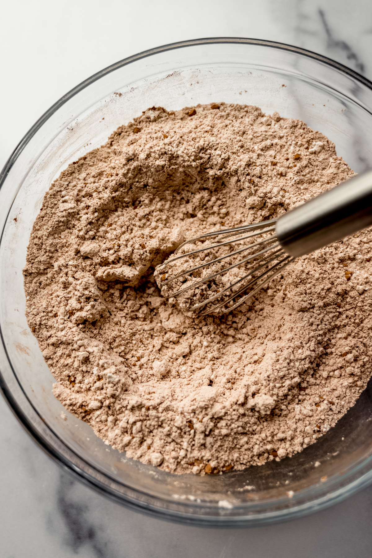 A bowl of dry ingredients whisked together.