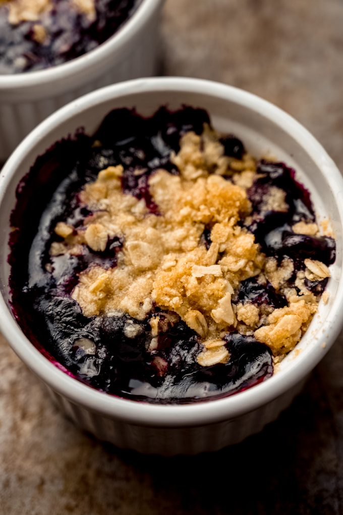 A ramekin of blueberry crisp.