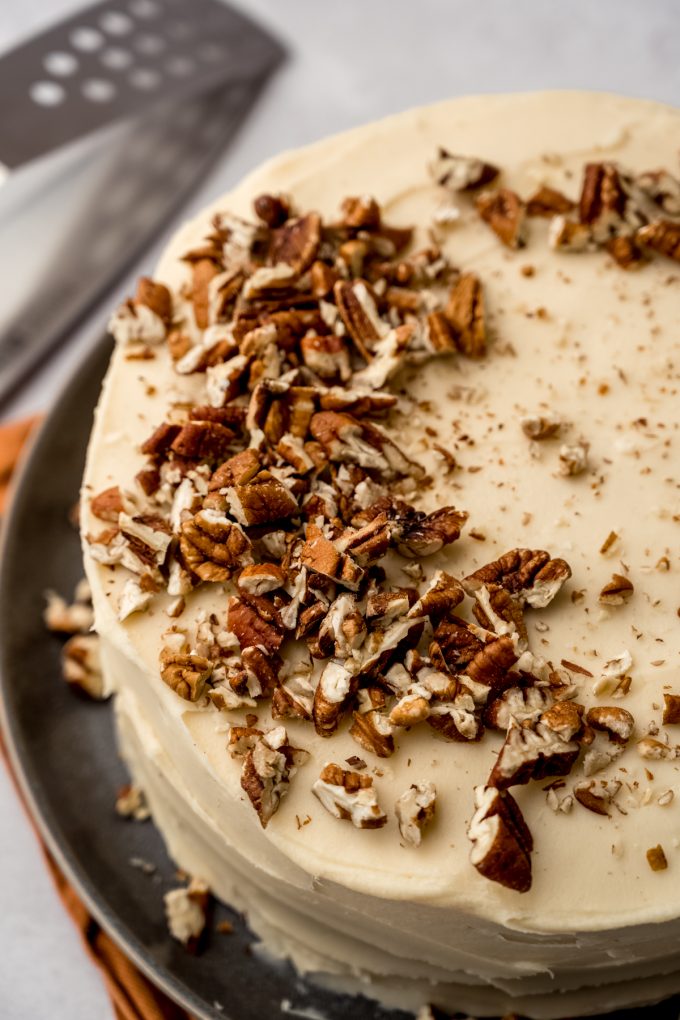 A butter pecan cake on a plate.