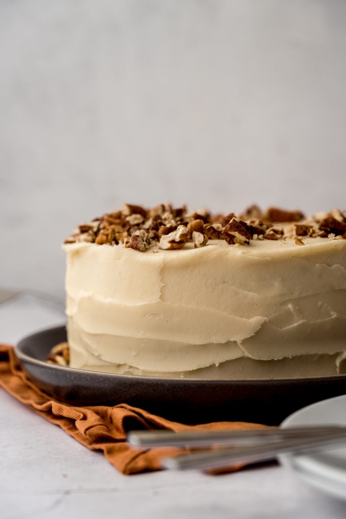A butter pecan cake on a plate.