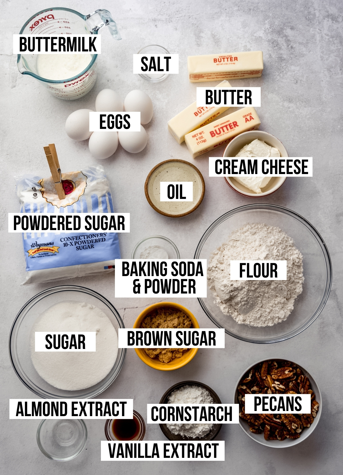 Aerial photo if the ingredients to make butter pecan cake with text overlay labeling each ingredient.
