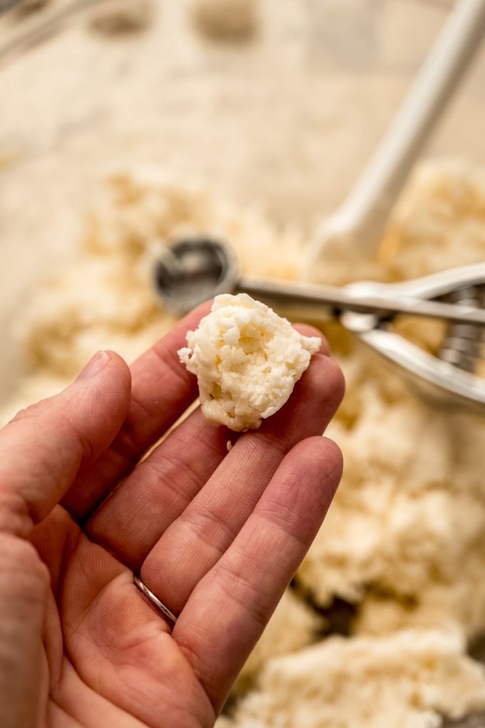 Someone is holding the filling for Irish potato candy.