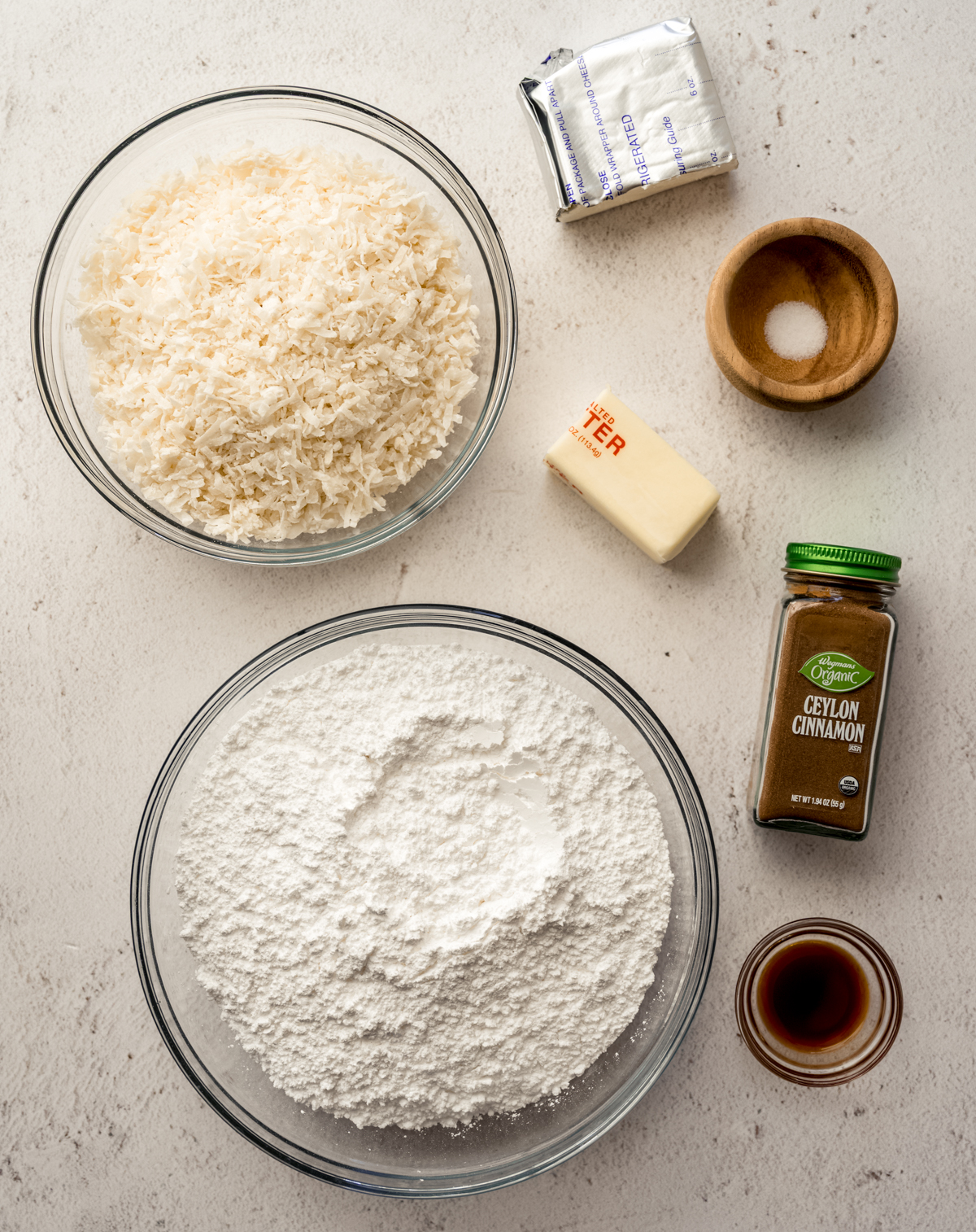 Aerial photo of ingredients to make Irish potato candy on a surface.