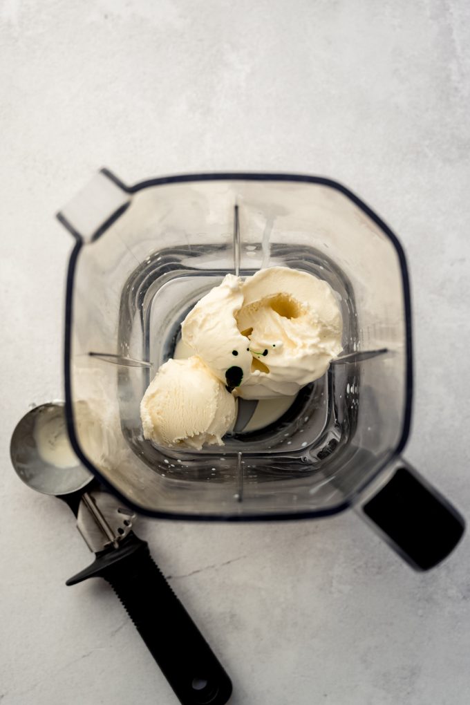 Aerial photo of a blender with homemade ingredients to make a Shamrock shake in it.