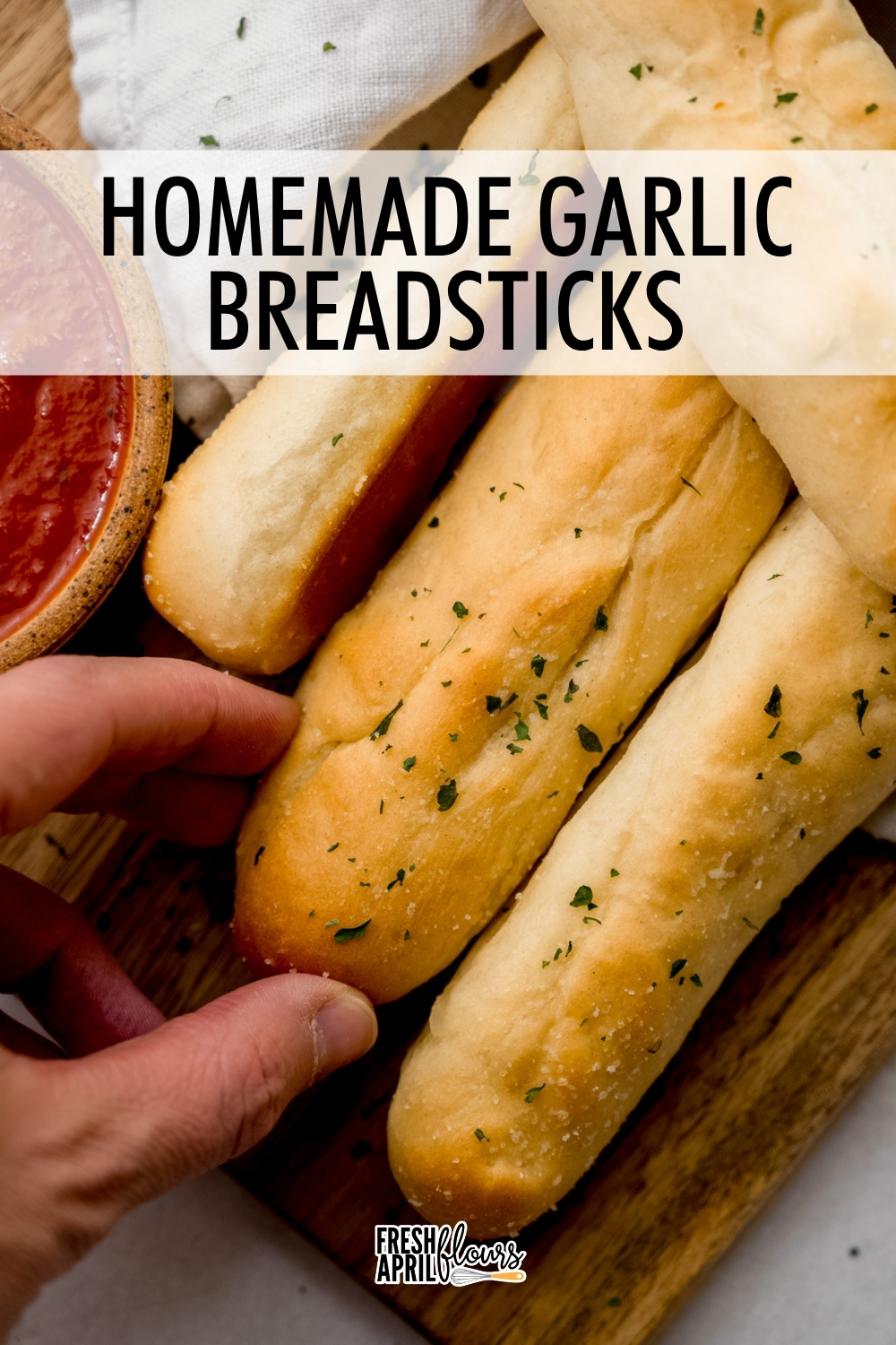 These homemade breadsticks are soft and fluffy on the inside and brushed with salted garlic butter for a flavorful addition to any meal. They will remind you of the ones from Olive Garden! via @frshaprilflours