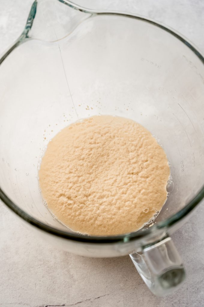 Activated yeast in the bowl of a stand mixer.