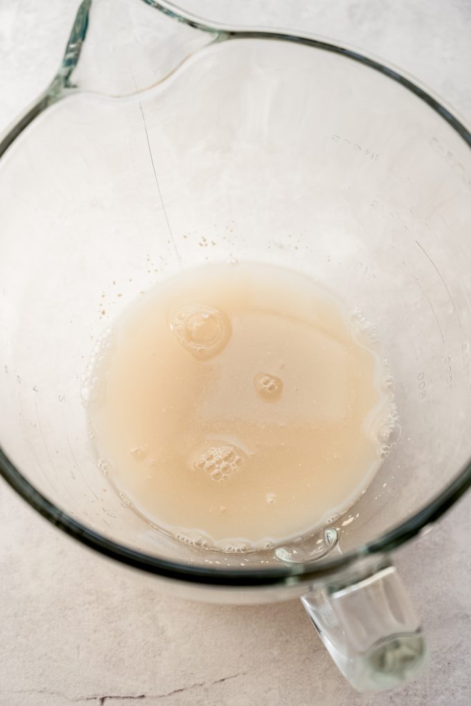 Yeast in water in the bottom of a bowl before it has activated.