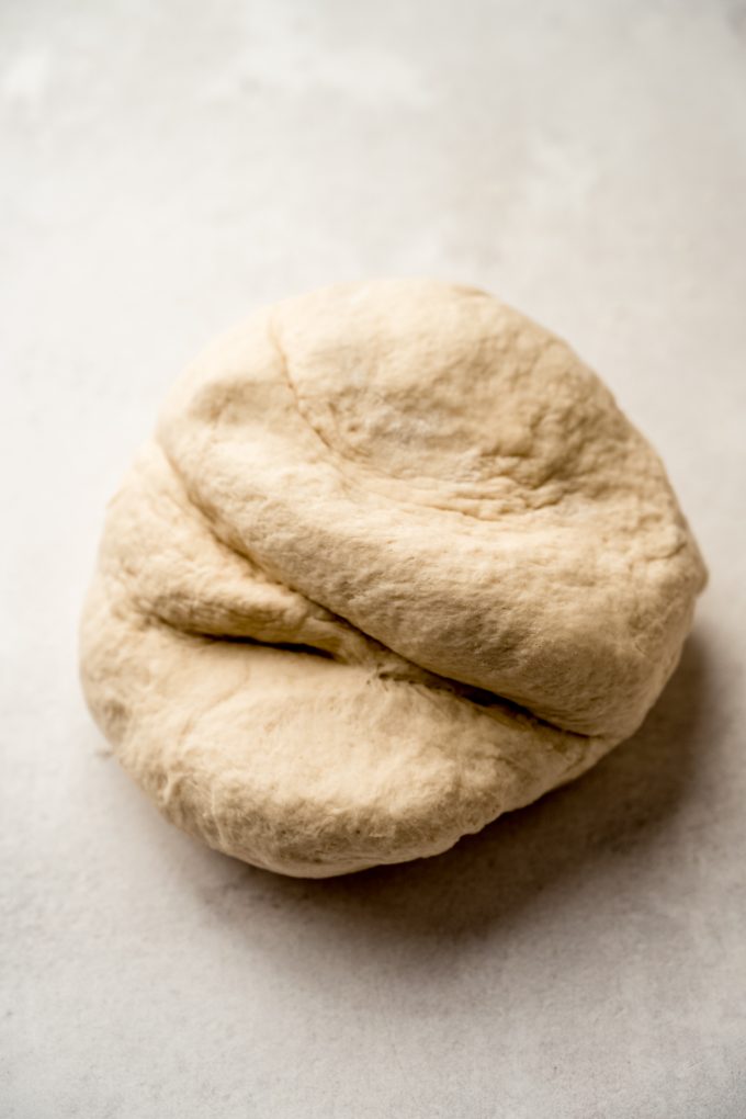 Bagel dough on a surface after kneading.