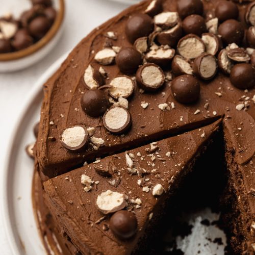 A sliced malt chocolate cake on a plate.